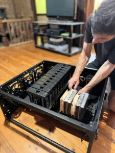 image of a man installing components in the server
